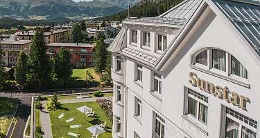 Sunstar Swiss Hotel Collection - Pontresina exterior view Exterior facade of the Sunstar Pontresina with mountains and forests in the background